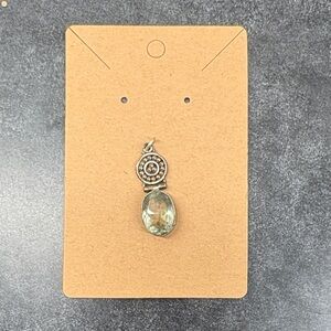 Elegant Silver Pendant with Green Gemstone